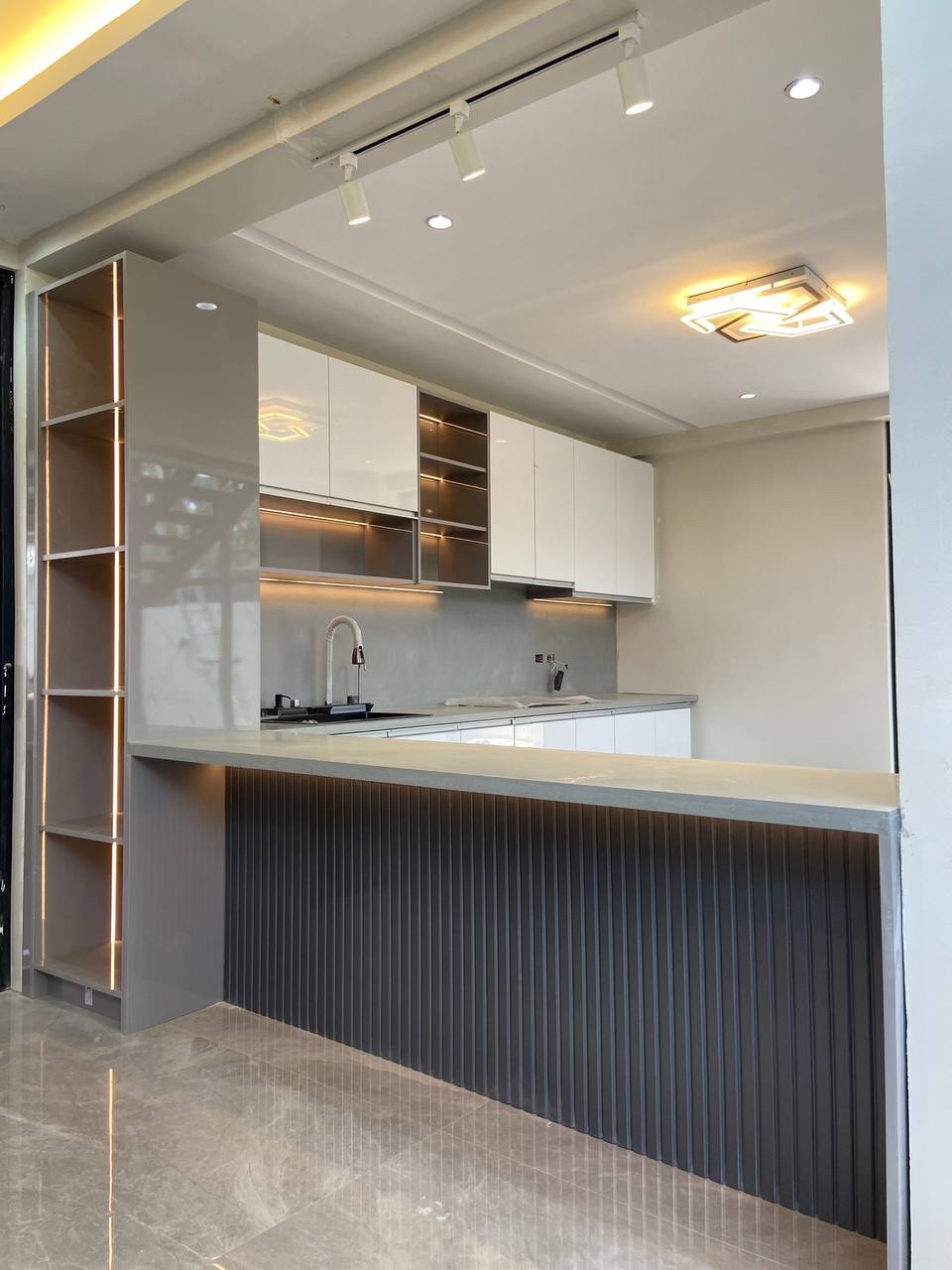 Modern modular kitchen design with custom cabinets by STERK Builders Philippines
